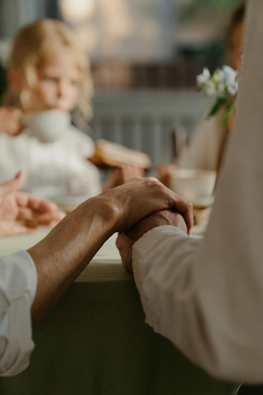 Seniors holding hands